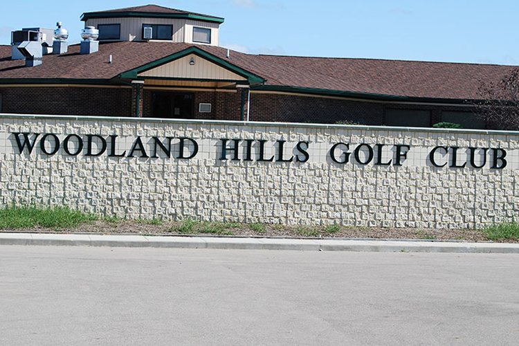 Woodland Hills Golf Club Clubhouse with sign